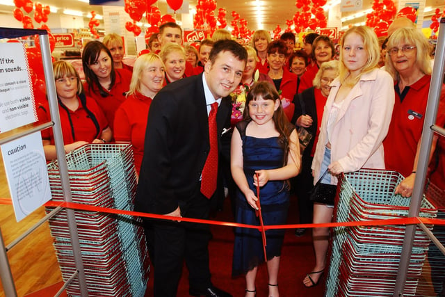 VIP, Jamie Henderson, is pictured reopening Woolworths in Middleton Grange Shopping Centre in 2005.