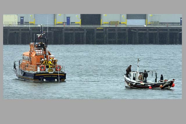 The coble is towed to safety. Picture: RNLI/Tom Collins