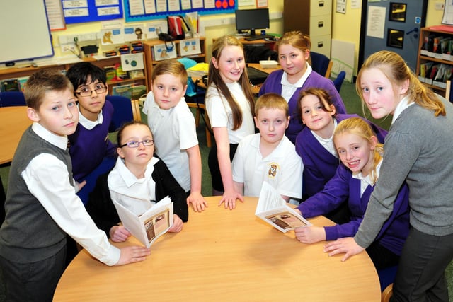 Grange Primary school pupils pose alongside their school magazine in 2014.