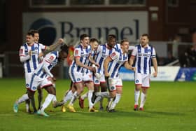 Hartlepool United's players celebrate after Joe Grey scored to win the penalty shootout during the FA Cup first round replay between Hartlepool United and Solihull Moors in November 2022.