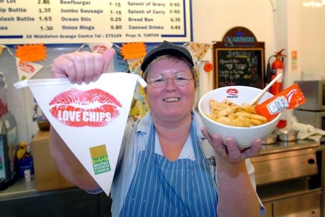 Mariners fish and chip shop manager, Julie Corser, poses with a bowl of chips in 2008.