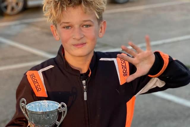 Jack with his trophy after achieving five podium finishes in a row.