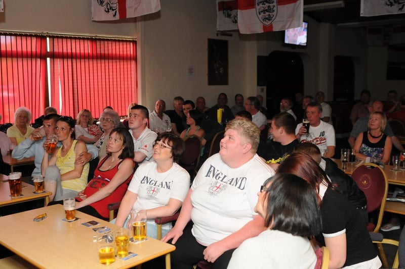 Supporters at the Belle Vue Sports and Social Club watch the 2010 England World cup clash with Algeria.
