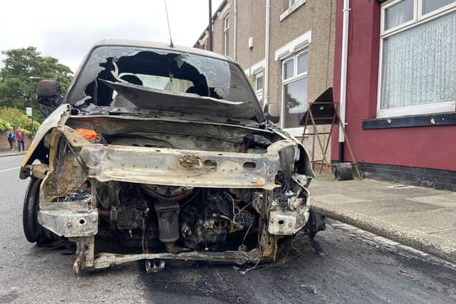 The remains of a car that was set on fire in Shrewsbury Street. Picture by FRANK REID