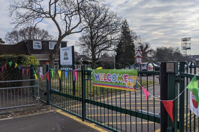 Welcome sign and bunting up at the school gate at Mengham Infants School.