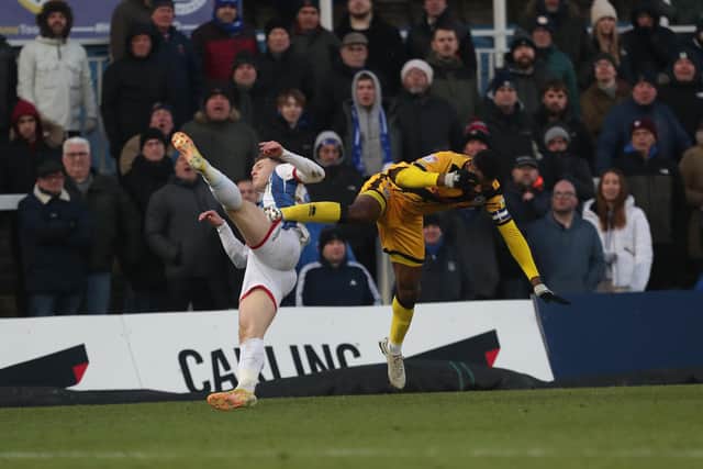 Rochdale's Ethan Ebanks-Landell catches Hartlepool United's Jack Hamilton with a high challenge which resulted in a red card. (Credit: Mark Fletcher | MI News)
