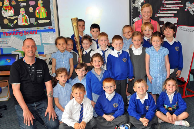 Brian Baines and his Olympic Torch met with pupils and teachers at St Bega's Primary School in 2012.