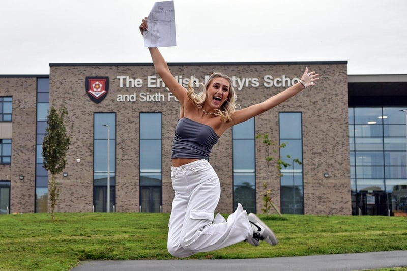 Elisha jumps for joy as she collects her GCSE results from the English Martyrs School.