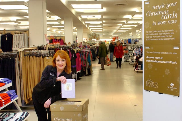 Back to 2013 and Marks & Spencer shop assistant Rachael Humphrey was pictured as she put a Christmas card into the recycling box at the store.