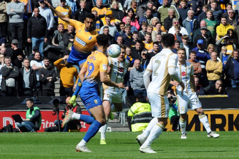 Mal Benning flies in on a free kick in the big promotion decider at MK Dons.