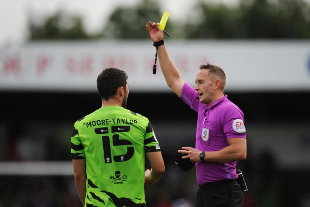 James Bell shows a yellow card to Jordan Moore-Taylor. Rovers had 66 yellow cards and two double bookings this season.