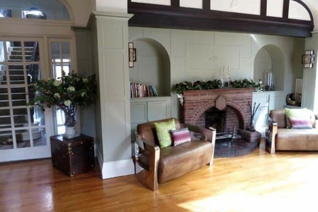 The reception hall boasts a feature brick fireplace.