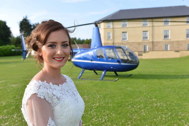 Olivia Anderson in front of the helicopter that brought her to the English Martyrs School prom held at Hardwick Hall.
