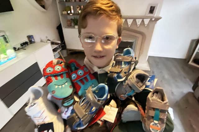 Jett Kilvington, 9, with a selection of odd shoes.