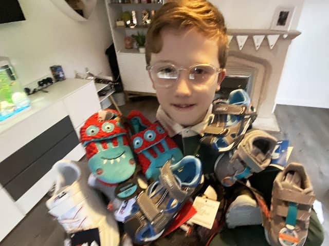Jett Kilvington, 9, with a selection of odd shoes.
