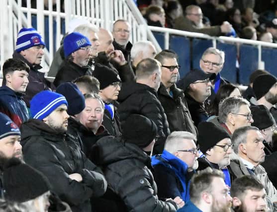 Fans intently watch the action during Tuesday's 3-2 National League victory over Altrincham at the Suit Direct Stadium.