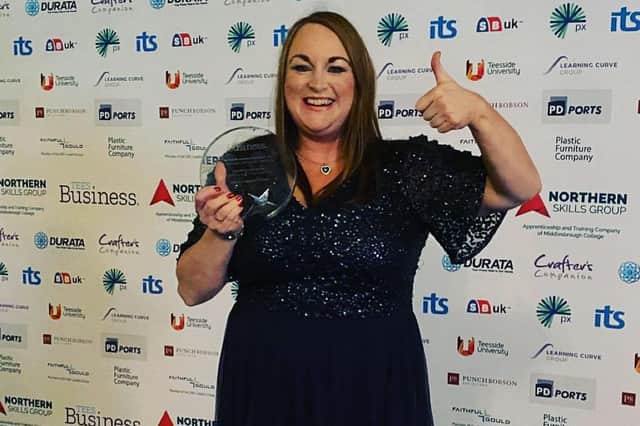 Lyndsay Hogg with the Small Business of the Year trophy.
