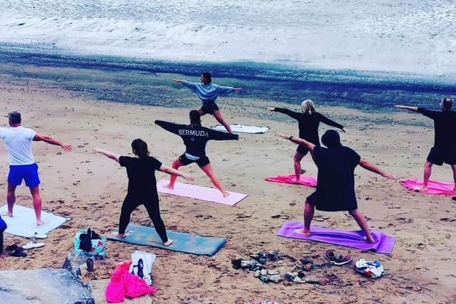 Cristina Moreira delivering a yoga class on the beach at Seaton Carew, Hartlepool.