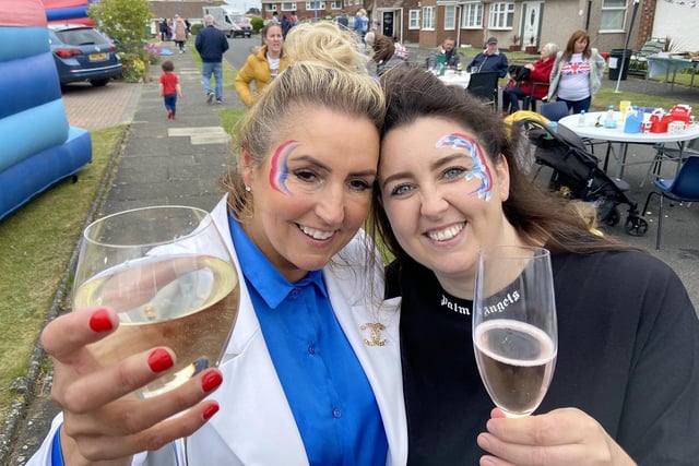 From left, Tracy Garthwaite and Jess Tait raise a glass during the Queen's Jubilee celebrations on Trentbrooke Avenue.