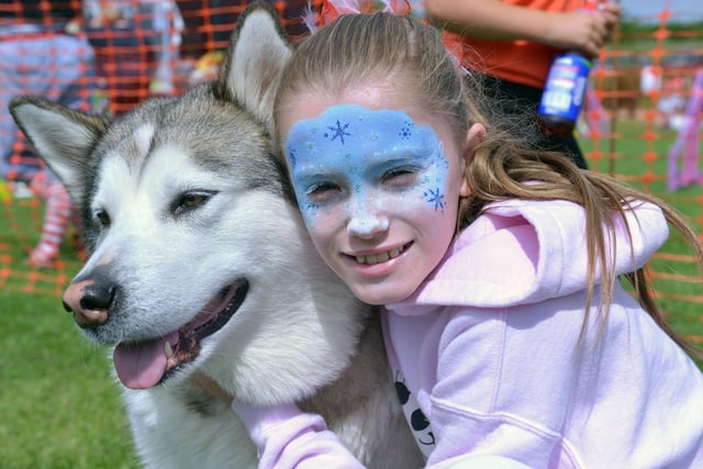Cuddles from Megan Costello for her Alaskan Malamute Kiera during the Dogs Day Out event at Summerhill in 2014.