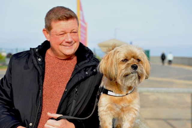 Alfie with his dad Graeme Gowdy take in the view over the beach at Seaton Carew. Picture by FRANK REID.