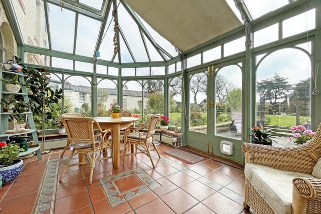 The spacious conservatory overlooks the garden and has easy access to the patio.