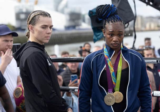 Savannah Marshall (L) and  Claressa Shields pose for a photo during a Boxxer media workout on a boat on the River Thames. (Photo by Eddie Keogh/Getty Images)