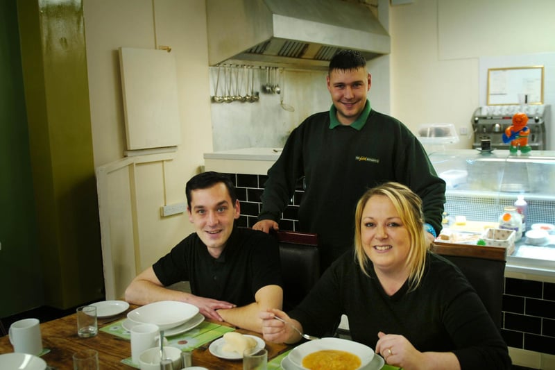 Claire Innes, Scott Mc Donald and Danny Conroy pose for a photo at the soup kitchen in 2013.