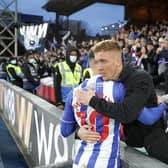 Hartlepool United player Luke Molyneux goes over to the club's travelling blue and white army of fans following his side's 2-0 defeat at Crystal Palace in the FA Cup.