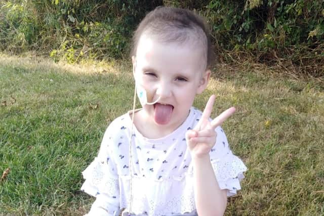 Iris Mai, aged five, has bravely battled neuroblastoma with a smile on her face.