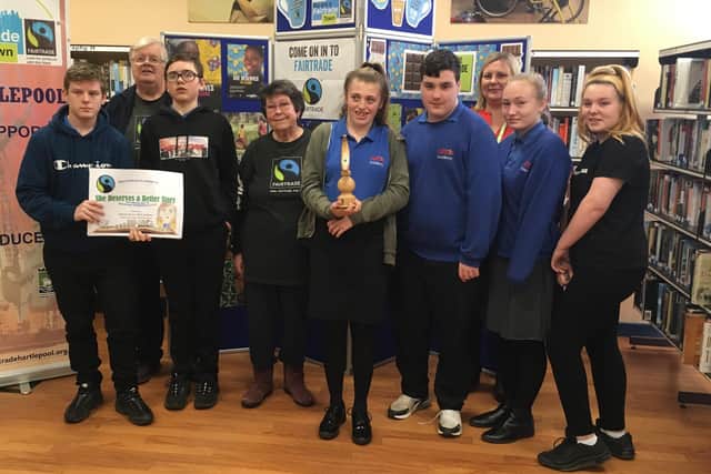 Catcote Academy students receive the Fairtrade banana trophy and certificates for winning this year's Fairtrade Fortnight schools competition.