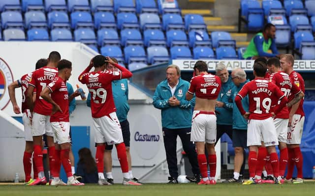 Neil Warnock talks to his players during Middlesbrough's 2-1 win at Reading.
