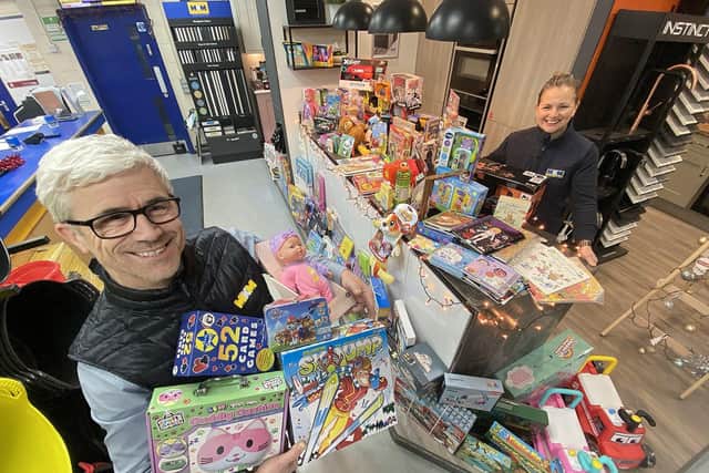 Lee Dees, co-director at MKM Building Supplies, and Jayne Plant, also from MKM building supplies, with a section of children's gifts and toys donated so far to the Hartlepool Mail-MKM 2023 Christmas gift appeal. Picture by FRANK REID.