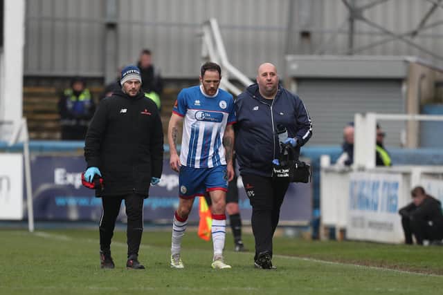 Hartlepool United's Tom Parkes leaves the field injured during the Vanarama National League home game against Barnet at Victoria Park on Saturday. Photo: Mark Fletcher | MI News.