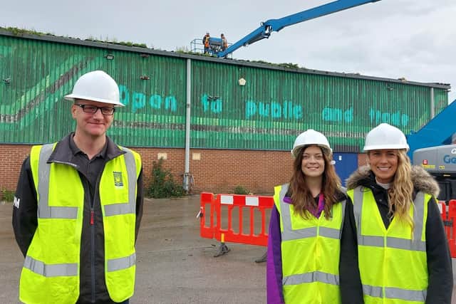 Left to right: Councillor Shane Moore, Bev Bearne and Amy Waller, the Council’s Principal Housing Officer (Place) watch the start of demolition on the former depot in Lynn Street.