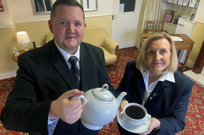 Terry McCormack pours a coffee for colleague Carole Lister at Meynell & Masons Funeral Home in 2023.