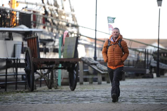 Jim Morton walks past HMS Trincomalee after reaching Hartlepool on Saturday.