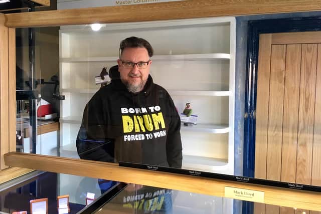 Mark Lloyd in his Park Road shop which is reopening from Wednesday. He has fitted new glass screens to help protect against Covid.