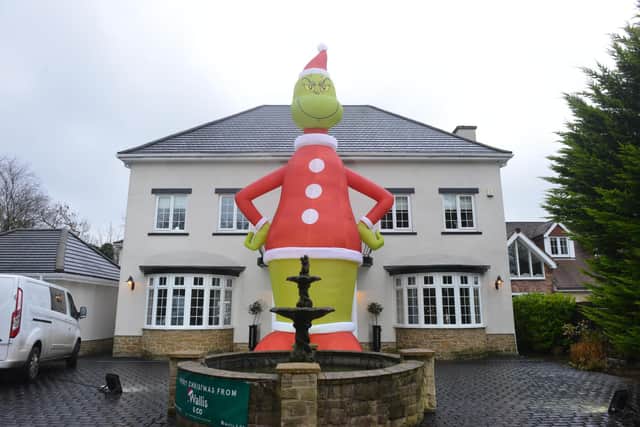 The giant inflatable Grinch outside the Liddell's Park Avenue home.