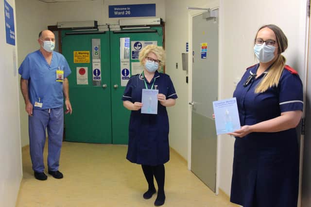 Hospital staff with the poetry book