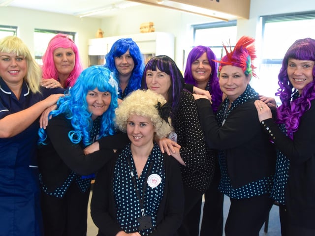 Staff at the West View Millennium Surgery, wearing colourful hairpieces for a Wigs Wednesday event in 2015.