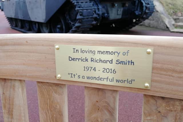 The plaque on the bench in memory of Derrick Smith.