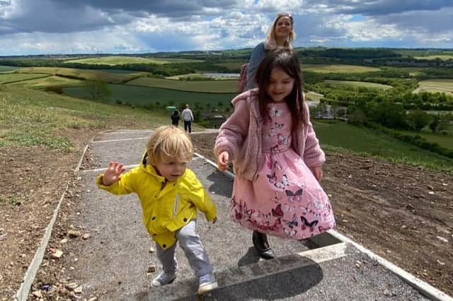Lyla O'Donovan with mum Kirsty and little brother Henry, 2, as they climb the steps to Penshaw Monument.