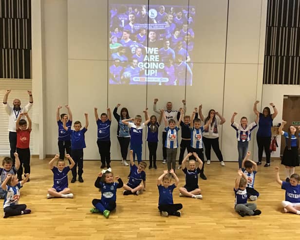 Jesmond Gardens Primary School staff and pupils celebrated Hartlepool United's promotion to the Football League by wearing kits on Monday.