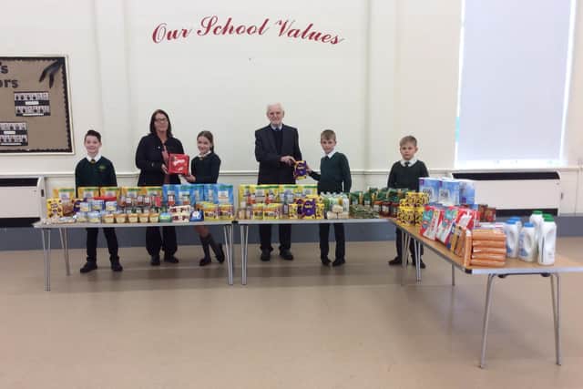 St Aidan's kitchen volunteer Claire Barker and parish administrator Katherine Batty came to St Aidan's School to collect the donations and thank Mr Atkinson (pictured) in person.