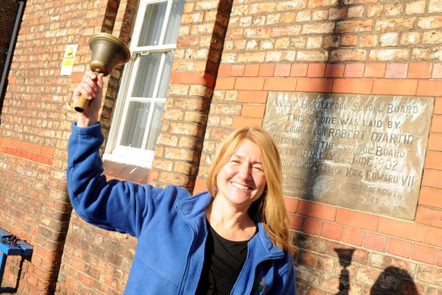 Headteacher Jane Loomes rings the final bell on the last day at Jesmond Road Primary School.