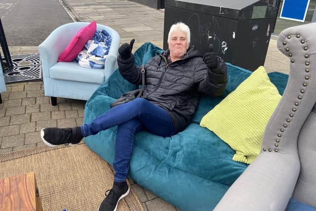 Alison Evans making use of the pop-up "living room" in York Road.