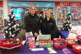 Julie and Jude from Alice House Hospice patrons EDF Energy volunteering on the Trees of Remembrance Stall in Middleton Grange Shopping Centre