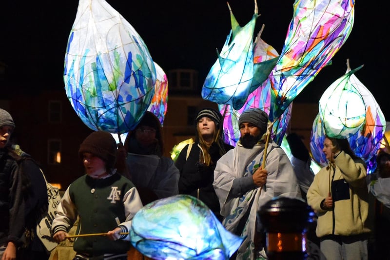 Parade participants carry lanterns created by art group Whippet Up to announce the beginning of the Wintertide Festival. Picture by BERNADETTE MALCOLMSON