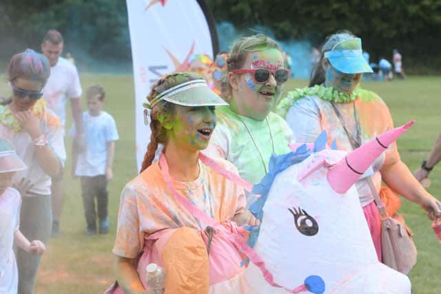 Participants were showered in colourful paints at four stations along the route.